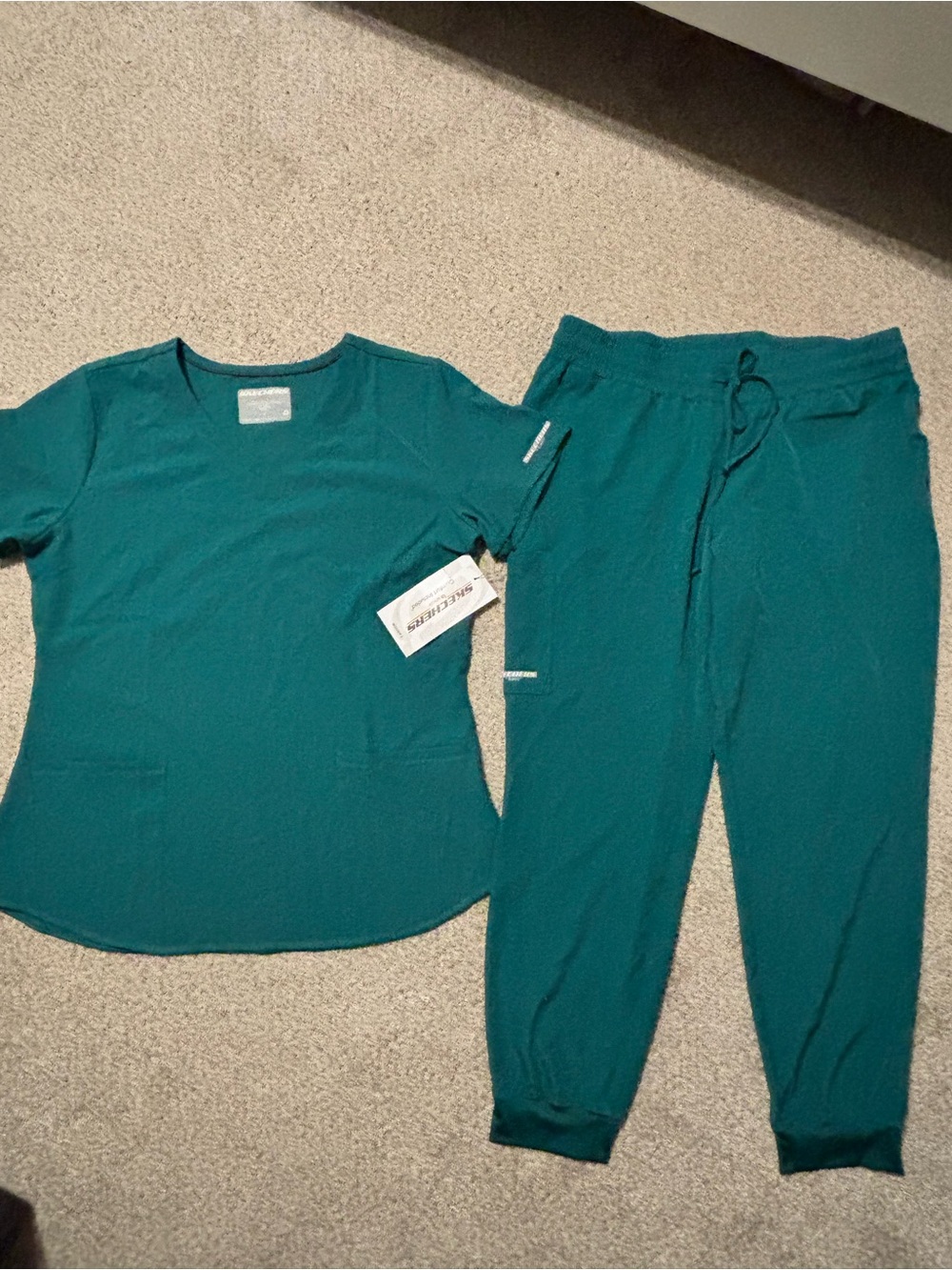 Sketchers scrub top and bottom